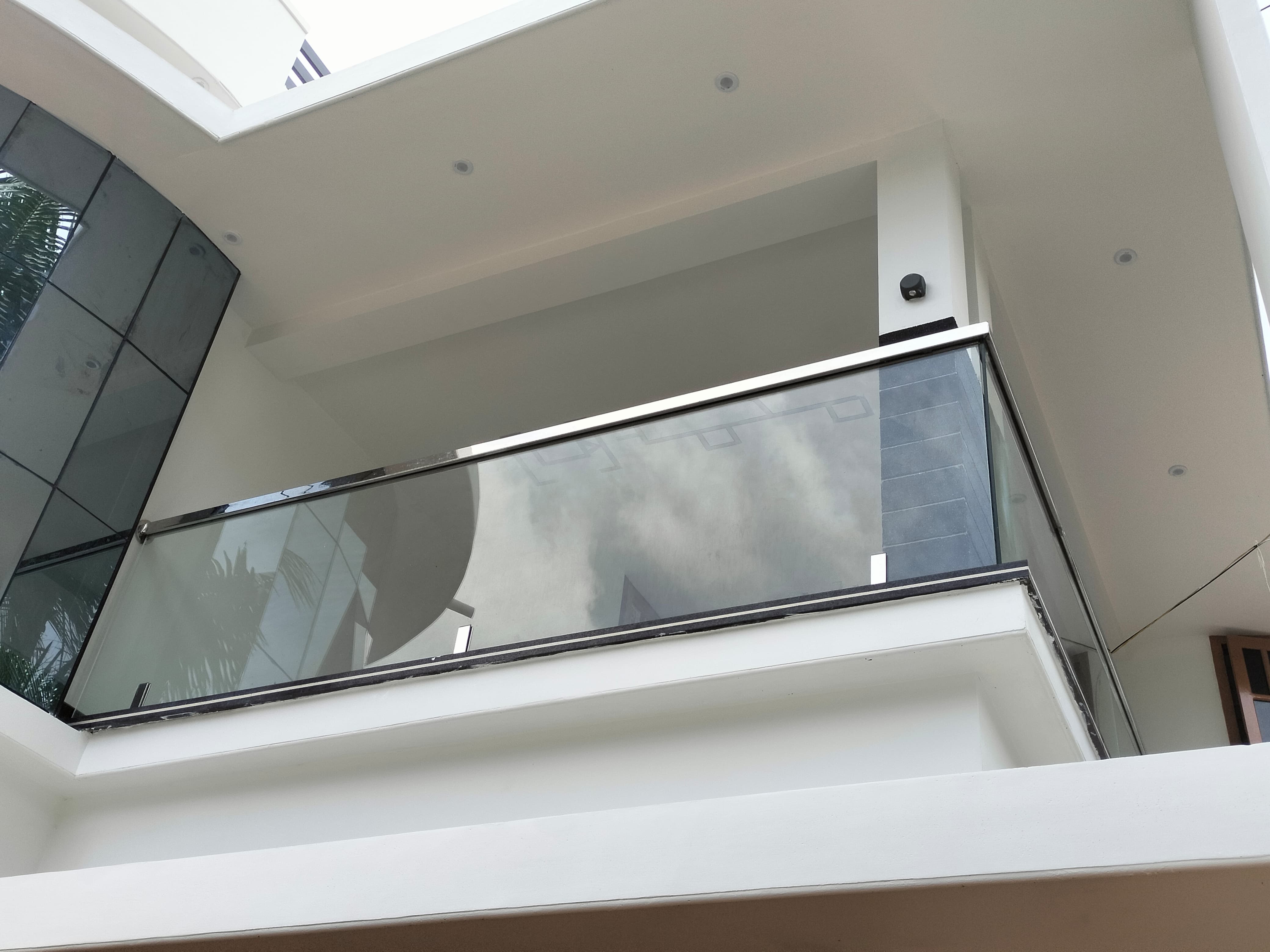 Stainless steel balcony with glass panels