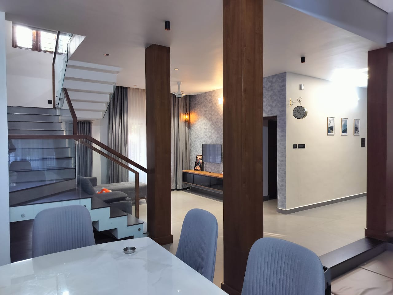 Interior staircase with glass and wood